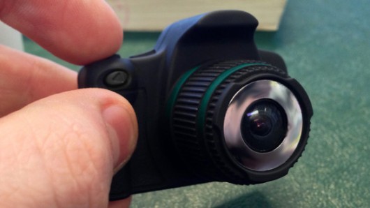 Pressing and holding the power button on the top brings the camera to life and it goes str...